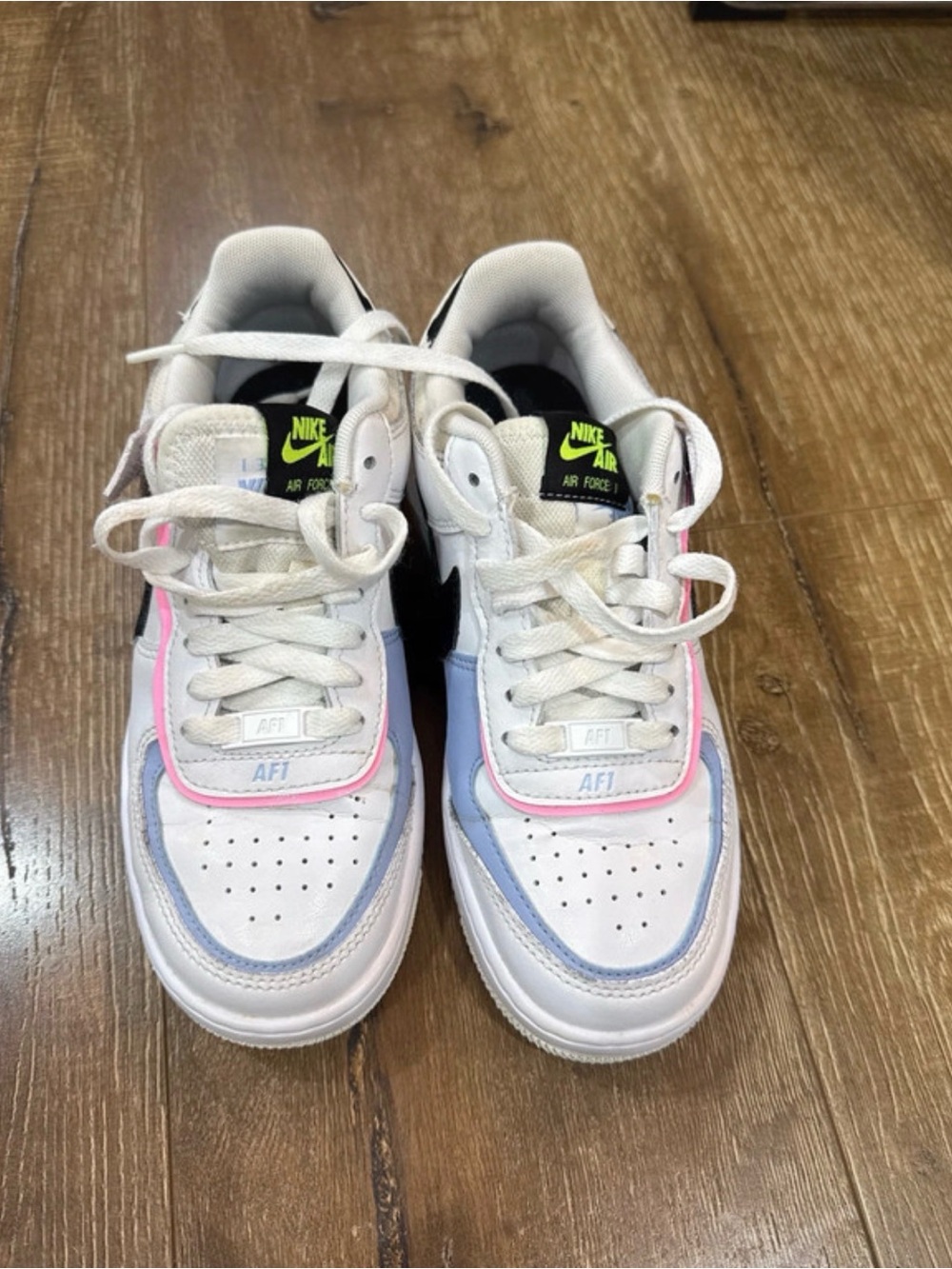Nike Kids White Sneakers with Pink and Light Blue Accents